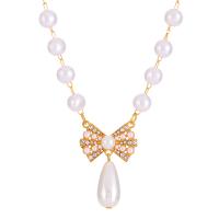 Plastic Pearl Necklace with Zinc Alloy with 7cm extender chain Bowknot gold color plated fashion jewelry & for woman & with rhinestone white Length 44 cm Sold By PC