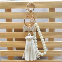 PU Leather Key Clasp, with ABS Plastic Pearl & Tibetan Style, Tassel, gold color plated, bowknot design & for woman & with rhinestone, more colors for choice, 58*150mm, Sold By PC