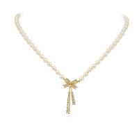 Plastic Pearl Necklace Zinc Alloy with Plastic Pearl with 2.75inch extender chain Bowknot gold color plated for woman & with rhinestone Length Approx 14.5 Inch Sold By PC