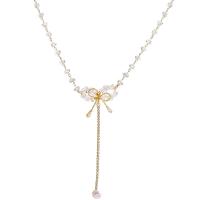 Cubic Zircon Micro Pave Brass Necklace, with Crystal & Plastic Pearl, with 5.2cm extender chain, Bowknot, gold color plated, fashion jewelry & adjustable & micro pave cubic zirconia & for woman, golden, nickel, lead & cadmium free, Length:Approx 35.5 cm, Sold By PC