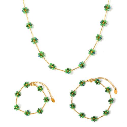 Acier titane parure de bijoux, avec Des billes de verre, fleur, Placage de couleur d'or, styles différents pour le choix & pour femme, Vendu par PC