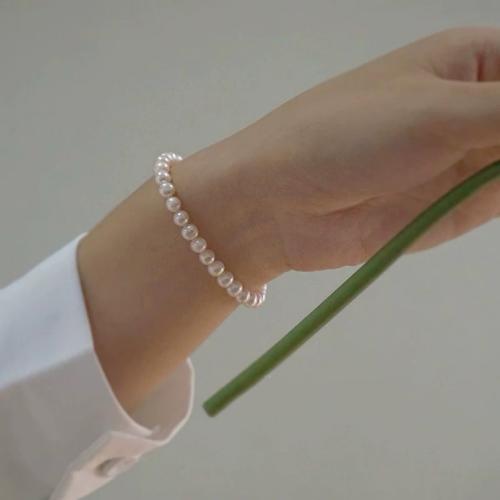 Freshwater Cultured Pearl Bracelet, Freshwater Pearl, with Brass, Slightly Round, gold color plated, fashion jewelry, white, 3x5mm, Sold By Strand